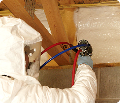 Room Temp Foam being applied to rim joists in the basement